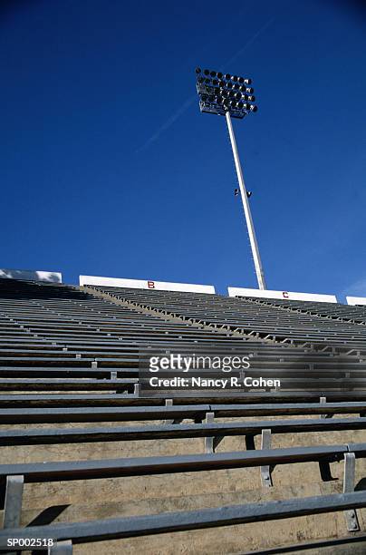 view of stadium seats and light - pharrell williams of n e r d sighting in new york ctiy stockfoto's en -beelden