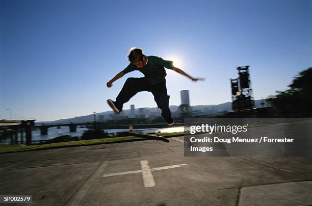 skateboarding in a parking lot - the lot stock-fotos und bilder