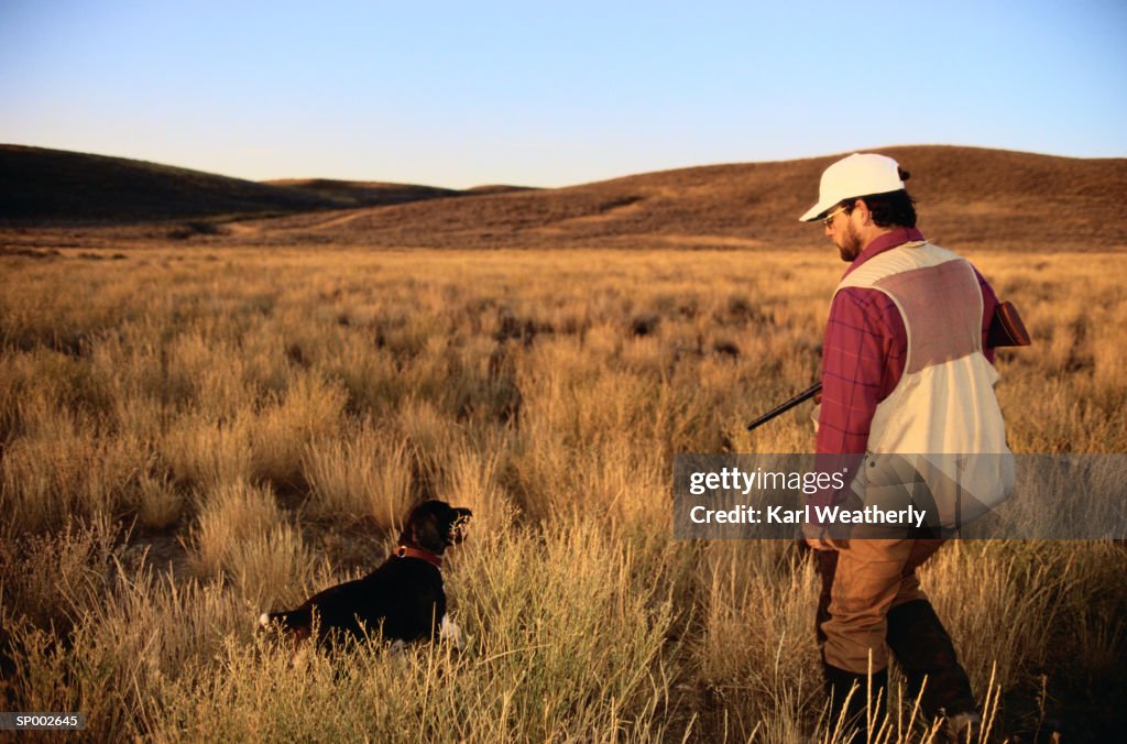 Man Hunting with Dog