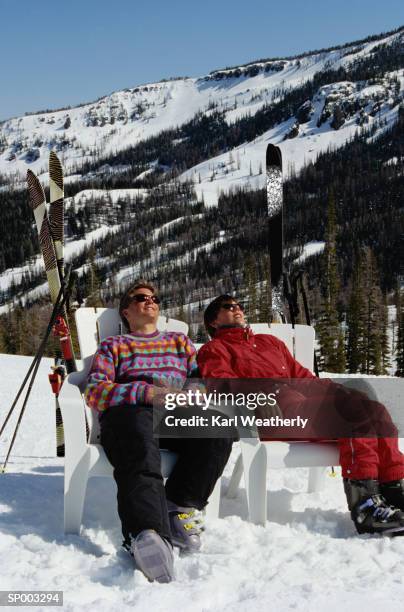 couple resting after skiing - after stock pictures, royalty-free photos & images