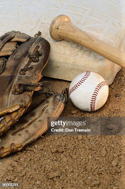 baseball, mitt, and bat on base - catchers mitt stock pictures, royalty-free photos & images