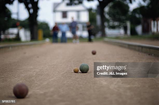 balls on bocce court - but stockfoto's en -beelden