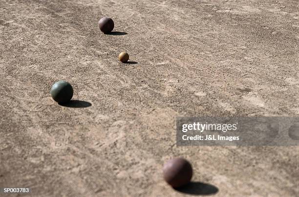 balls on bocce court - but stockfoto's en -beelden