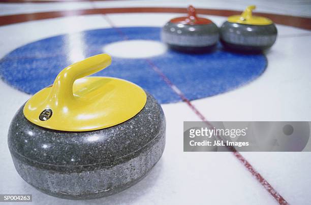 curling stones close-up - curling stone stock pictures, royalty-free photos & images