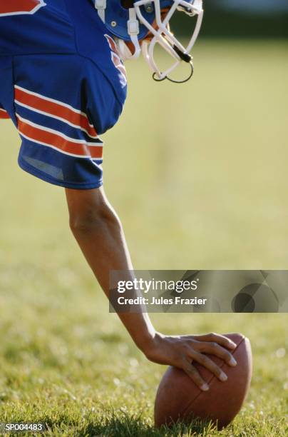 football lineman with a football - american football uniform stock pictures, royalty-free photos & images