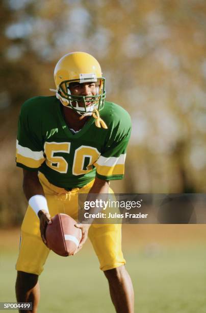 football player - american football uniform stock pictures, royalty-free photos & images