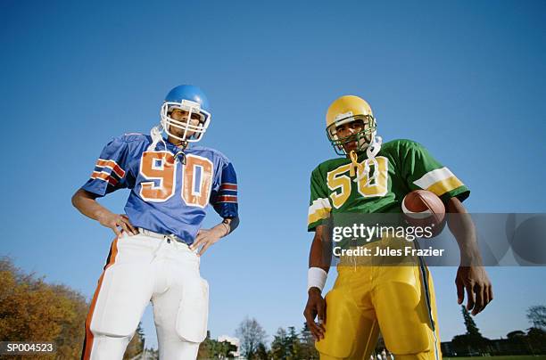 football players - american football uniform stock pictures, royalty-free photos & images