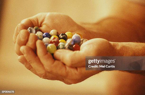 holding marbles - curtis stockfoto's en -beelden