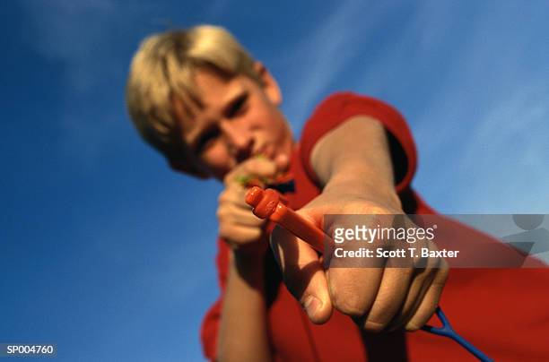 boy with slingshot - scott stock pictures, royalty-free photos & images