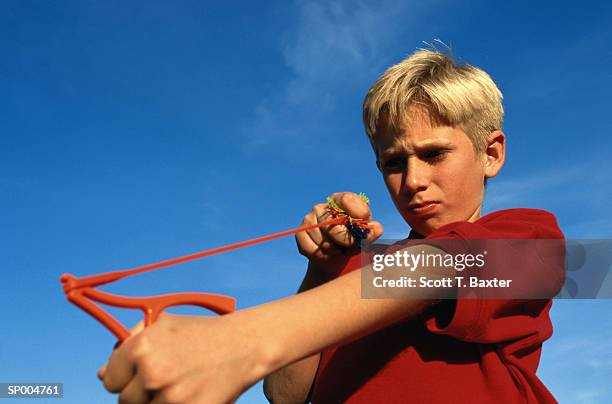 boy with slingshot - scott stock pictures, royalty-free photos & images