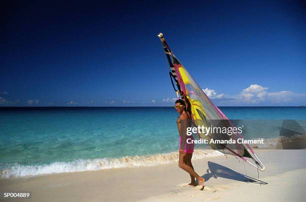 man with windsurfing sail - amanda blue stock pictures, royalty-free photos & images