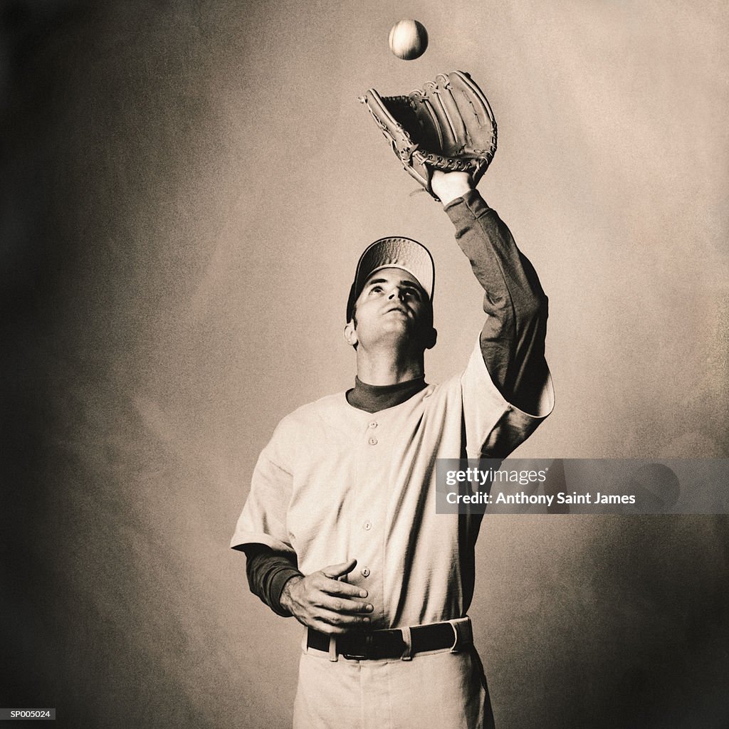 Man Catching a Baseball