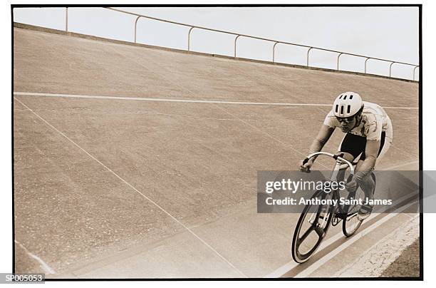 riding bicycle on track - saint anthony stock pictures, royalty-free photos & images