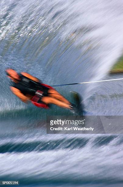 blur of man water-skiing - karl stock pictures, royalty-free photos & images