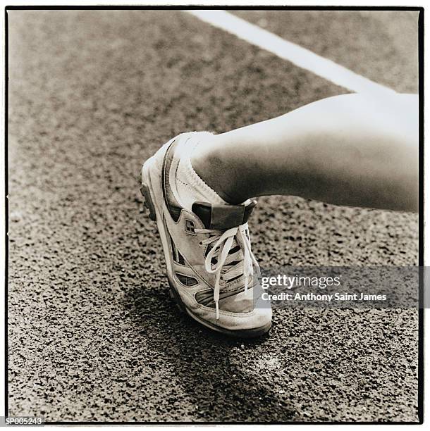 close-up of athlete's foot on running track - saint anthony stock pictures, royalty-free photos & images