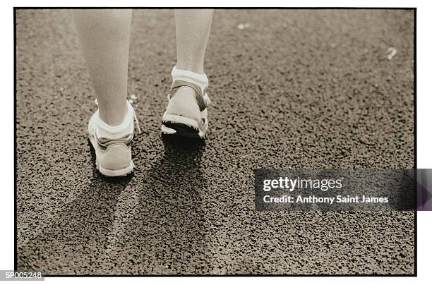 close-up of athlete's feet on track - saint anthony stock pictures, royalty-free photos & images