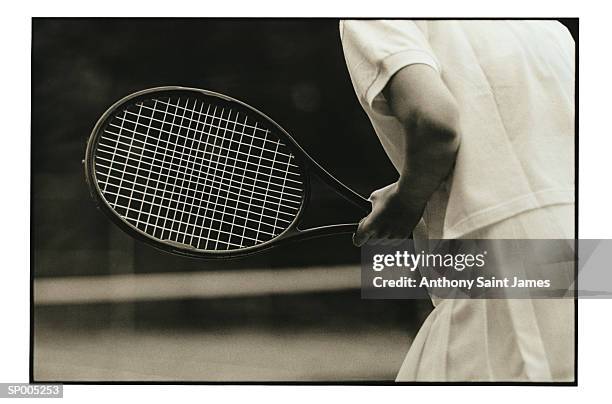 detail of athlete with tennis racket - saint anthony stock pictures, royalty-free photos & images