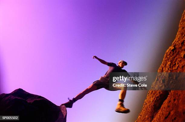 man jumping between boulders - president trump hosts public safety medal of valor awards at white house stockfoto's en -beelden