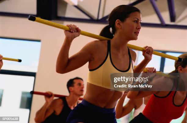 woman in an aerobics class - ryan mcvay stock pictures, royalty-free photos & images