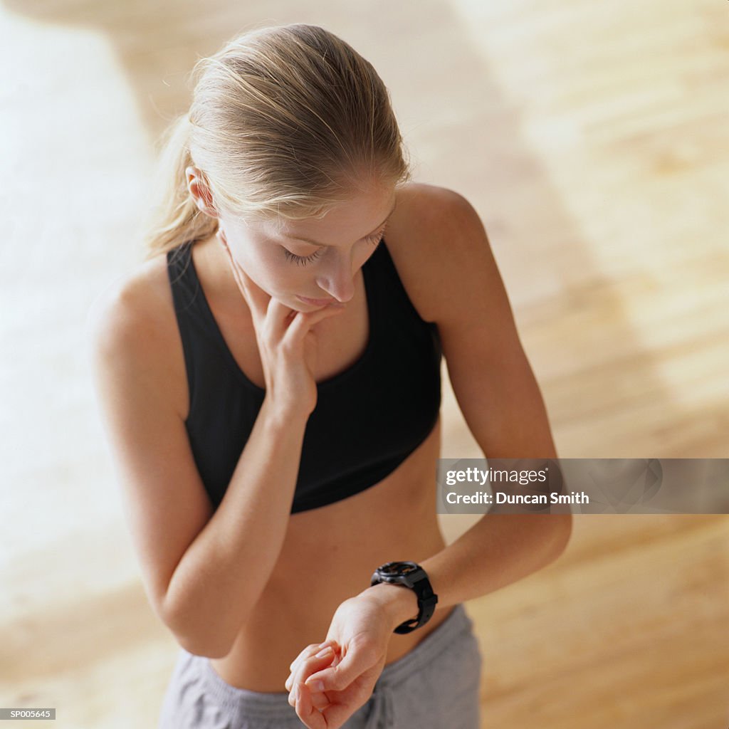 Woman Taking her Pulse After Exercising