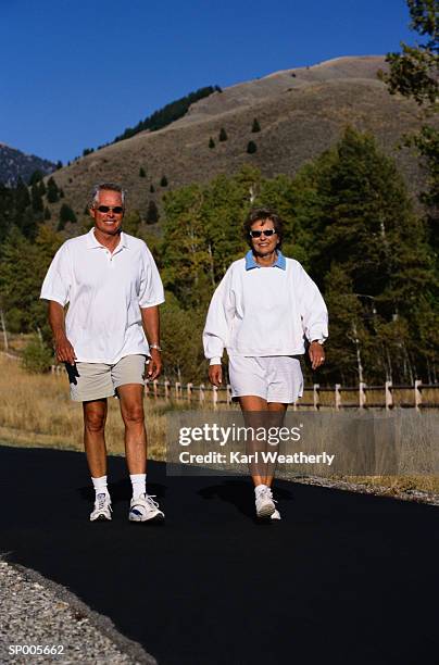 couple walking on a trail - karl stock pictures, royalty-free photos & images