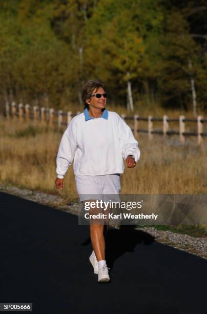 woman walking on a trail - karl stock pictures, royalty-free photos & images