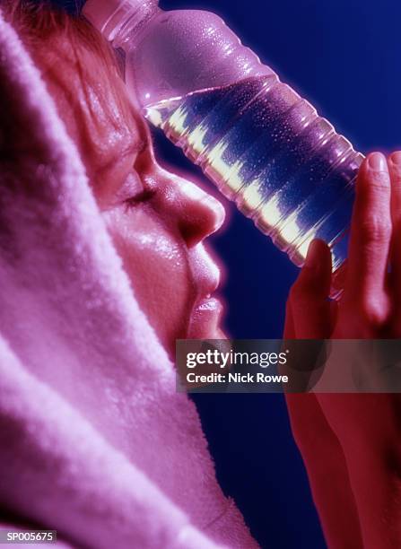 woman with bottled water - nick stock pictures, royalty-free photos & images
