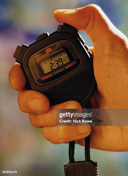 holding a stopwatch - nick stock-fotos und bilder