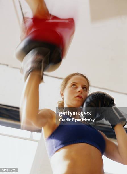 woman kick boxing - ryan stock pictures, royalty-free photos & images