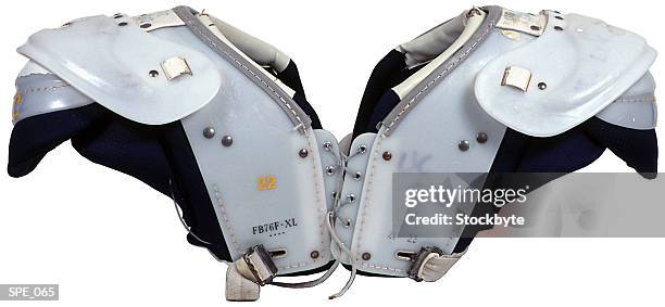 shoulder pads - football uniform stock pictures, royalty-free photos & images