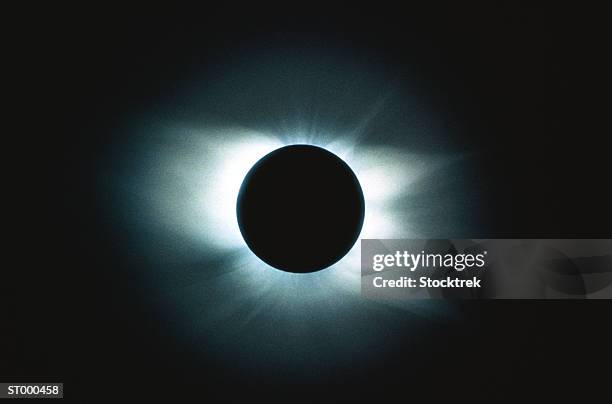 solar eclipse showing the corona - eclipse foto e immagini stock