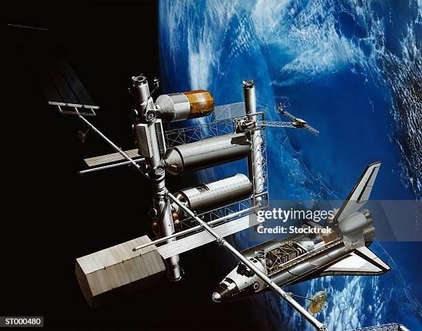 illustrazioni stock, clip art, cartoni animati e icone di tendenza di painting showing space shuttle and space station - space shuttle