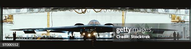 stealth bomber in the hanger - stealth bomber foto e immagini stock