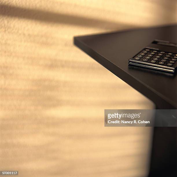 calculator on table - pharrell williams of n e r d sighting in new york ctiy stockfoto's en -beelden