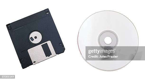 floppy disk and a compact disc - computer disk stock pictures, royalty-free photos & images
