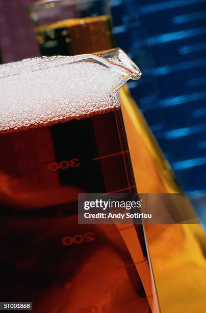 foaming liquid in beaker - andy stock pictures, royalty-free photos & images