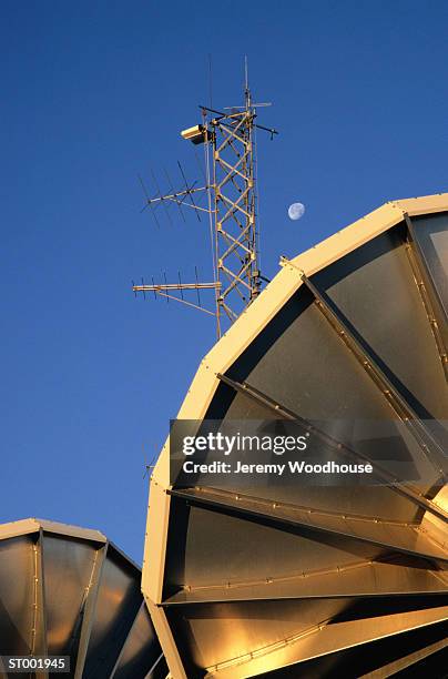 satellite dishes and telecommunications tower - richardson stock pictures, royalty-free photos & images