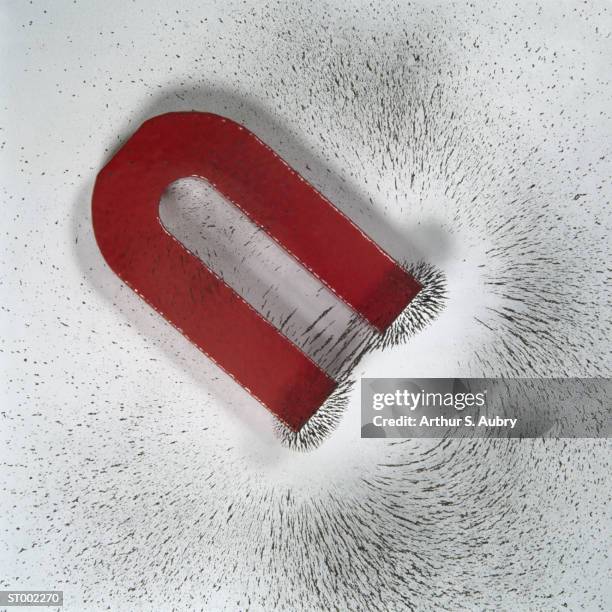 magnet and iron filings - iron filing stock pictures, royalty-free photos & images