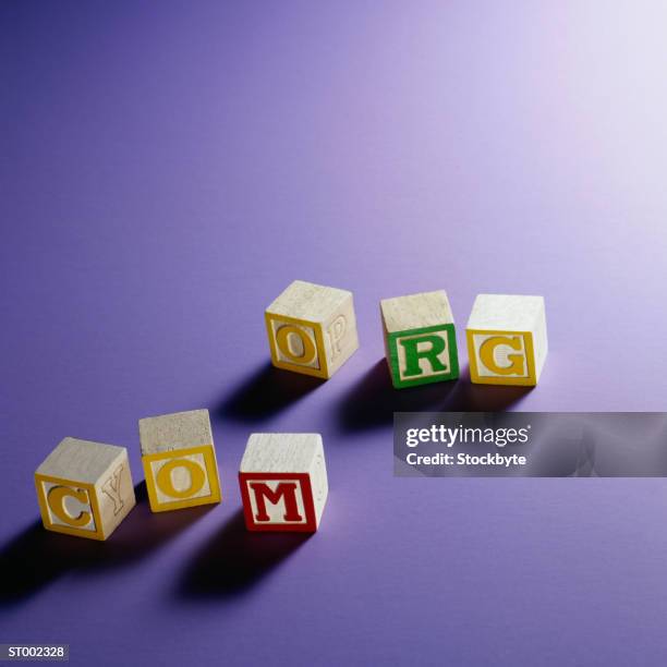 com and org on alphabet blocks - com fotografías e imágenes de stock