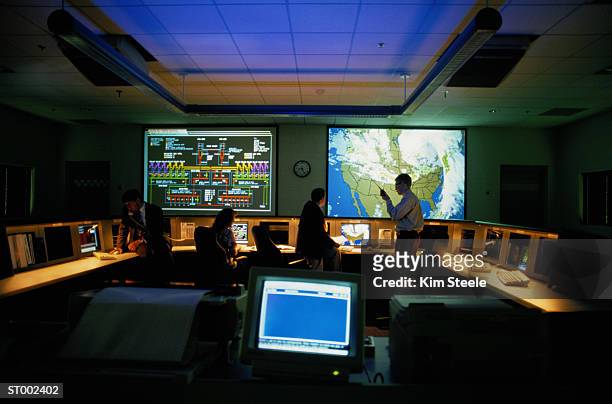 meteorologists in a weather monitoring room - meteorologist stock pictures, royalty-free photos & images