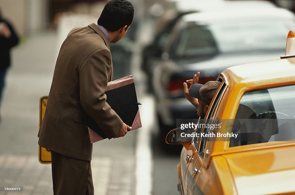 Businessman Talking to a Taxi Driver