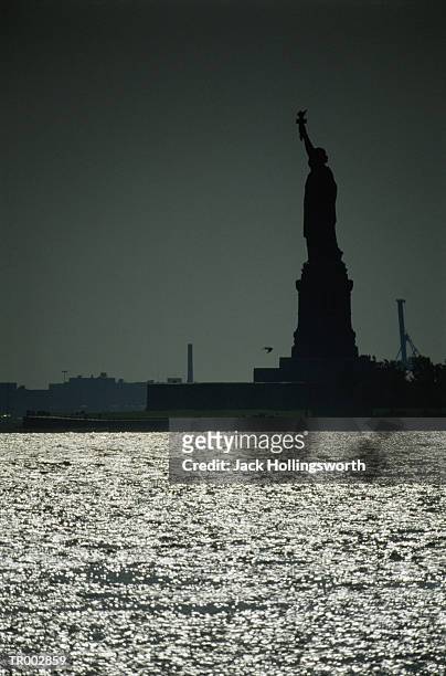 silhouette of statue of liberty - liberty island stock pictures, royalty-free photos & images