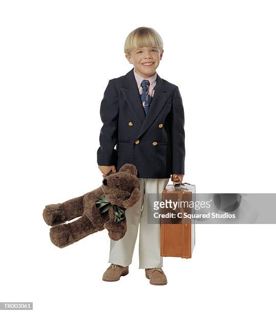 boy carrying a suitcase and a teddy bear - cast of a c o d entertainment weekly january 24 2013 stockfoto's en -beelden