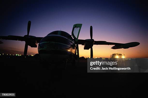 prop plane at sunset - propeller plane stock-fotos und bilder