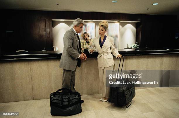 couple at hotel check in - check up ストックフォトと画像
