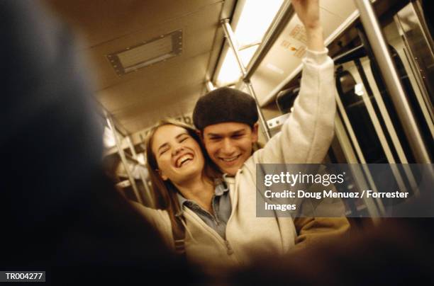 couple riding the train - doug stock pictures, royalty-free photos & images