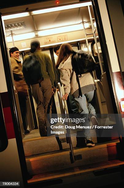 passengers loading train - doug stock pictures, royalty-free photos & images