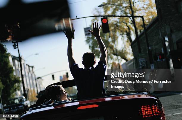 teens in car having fun - human limb stock pictures, royalty-free photos & images