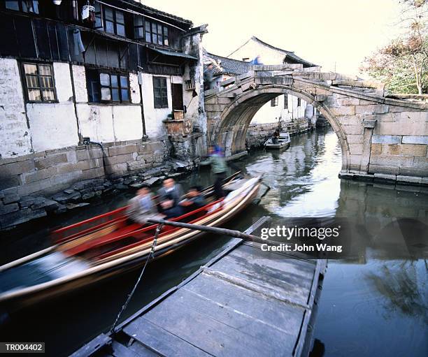 boat passing under a bridge - german foreign minister gabriel meets foreign minister of china stockfoto's en -beelden