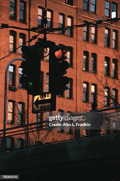 traffic light, building in background, low angle view - one way communication stock pictures, royalty-free photos & images